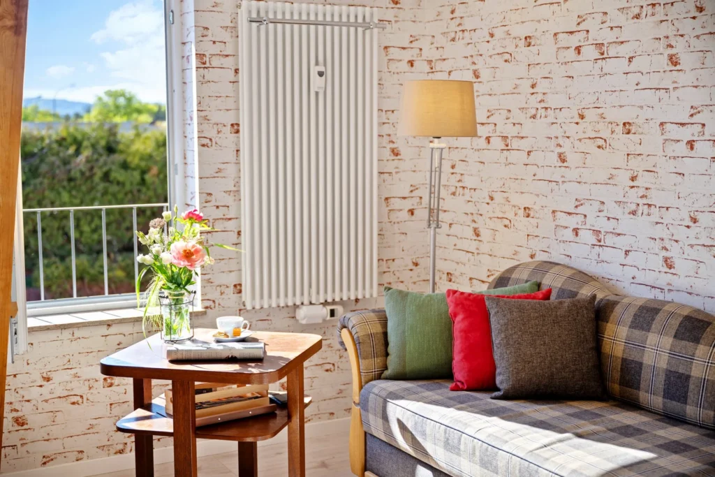 Sofa by the window with a view of greenery